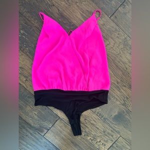 Backless bodysuit. Black and hot pink.